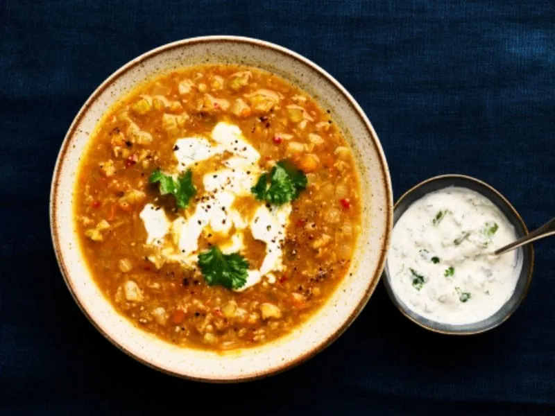 Curried lentil soup with yogurt drizzle