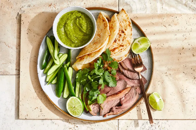 Roasted beef rump with spring onion and coriander sauce