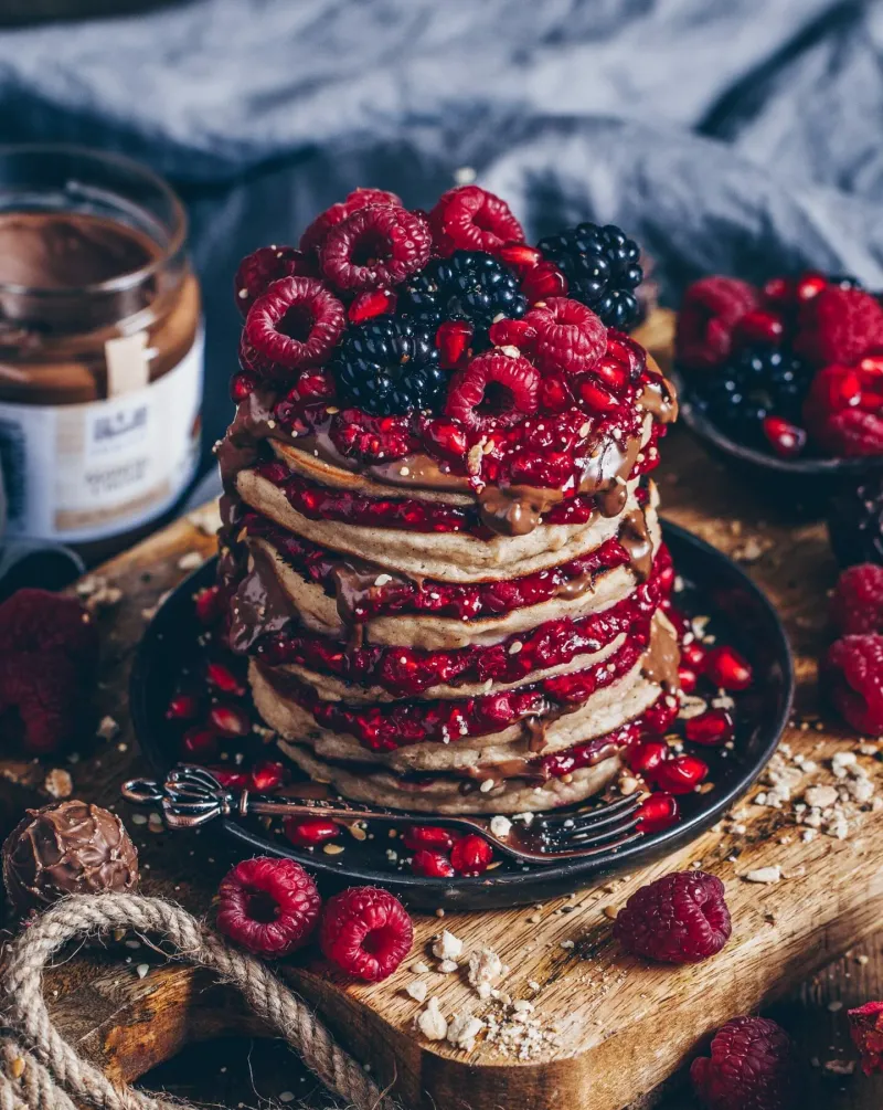 Almond Pancakes with hot raspberries and almond cream