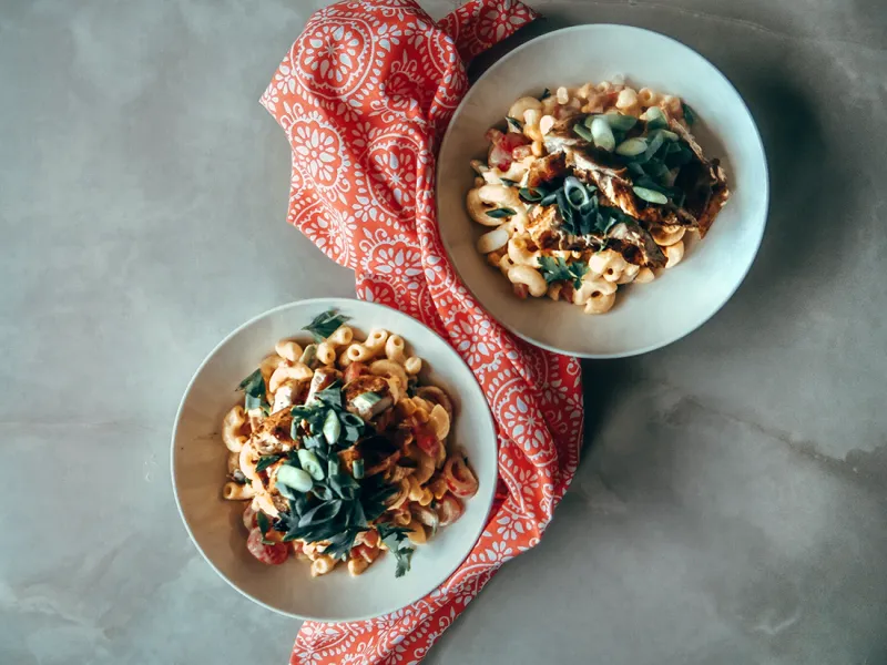 Grilled Cajun chicken chicken pasta salad with sweet & spicy butter sauce