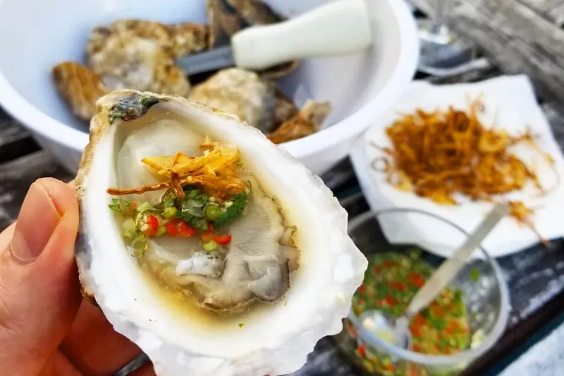 Chilled oysters with Thai seafood sauce (nam jim seafood) and crispy shallots