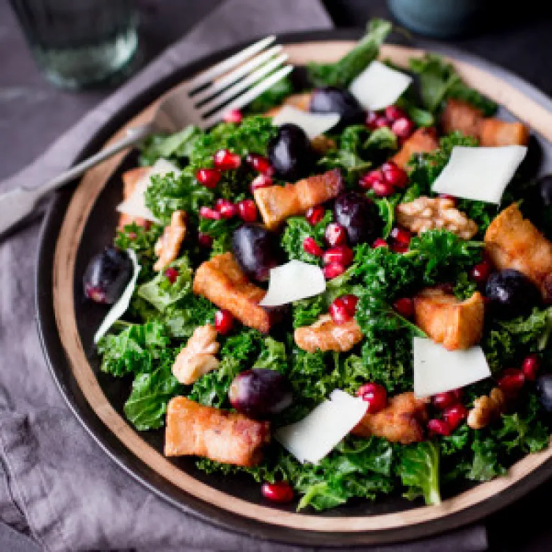 Warm Kale & Pork Belly Salad with Pomegranate Dressing