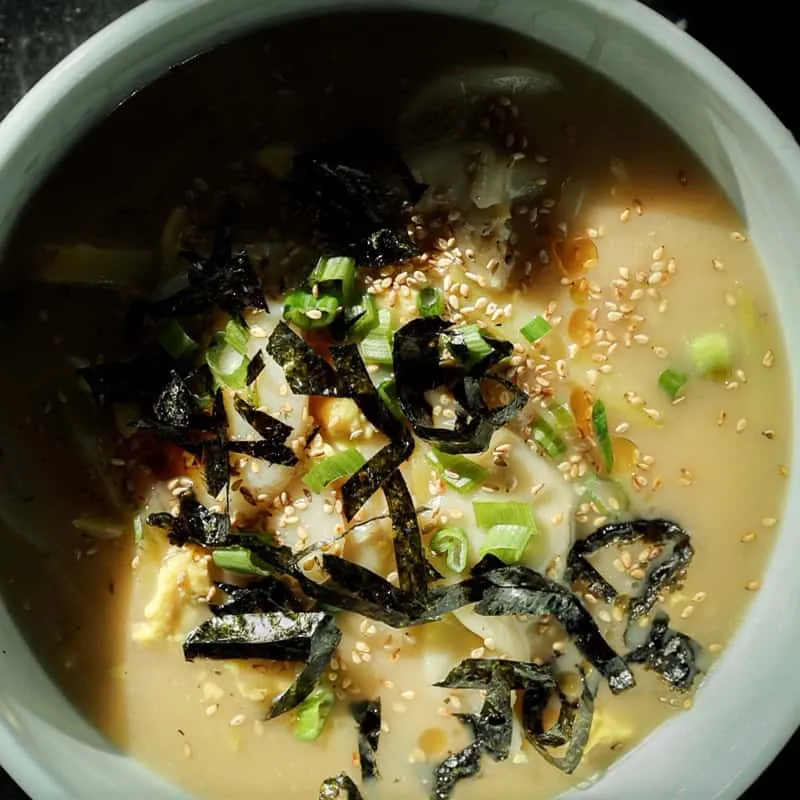 Korean Vegan Rice Cake Soup (Tteokguk) with Dumplings.