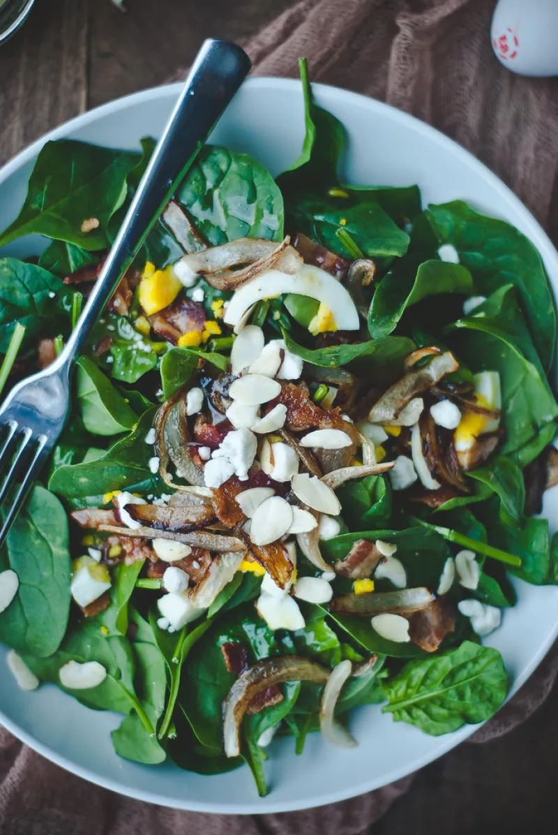 Spinach salad with warm bacon-honey mustard dressing.