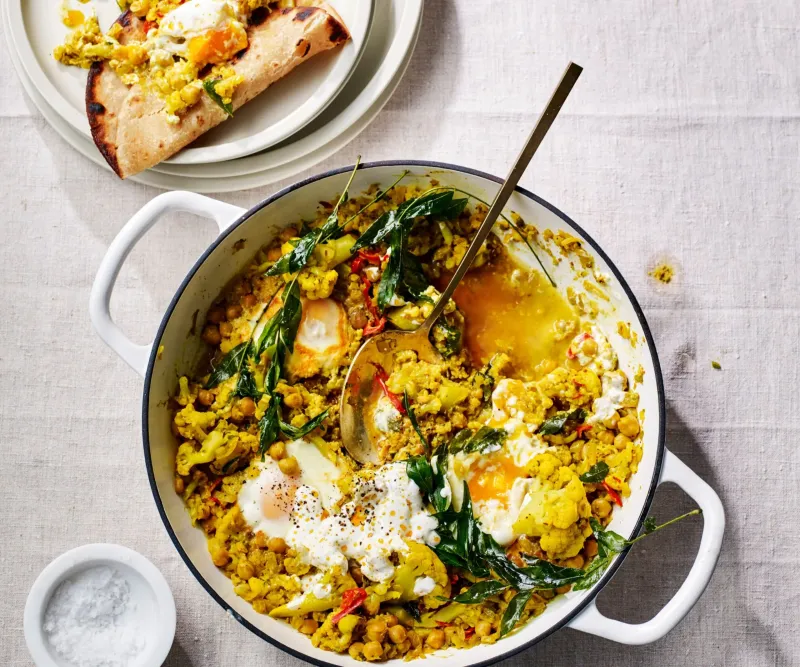 Cauliflower and chickpea masala with poached eggs