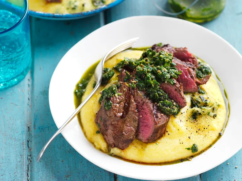 Grilled steak with salsa verde and soft polenta